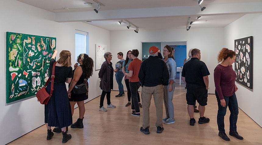 crowd of people viewing an exhibit